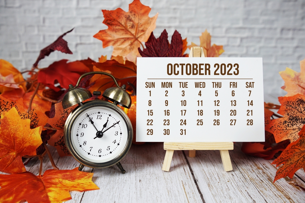 October,2023,Monthly,Calendar,Maple,Leaf,Decoration,On,Wooden,Background